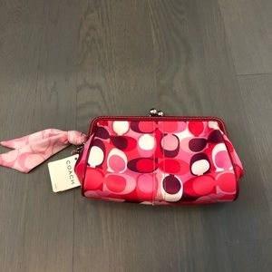 Scarf print wristlet (by Coach)